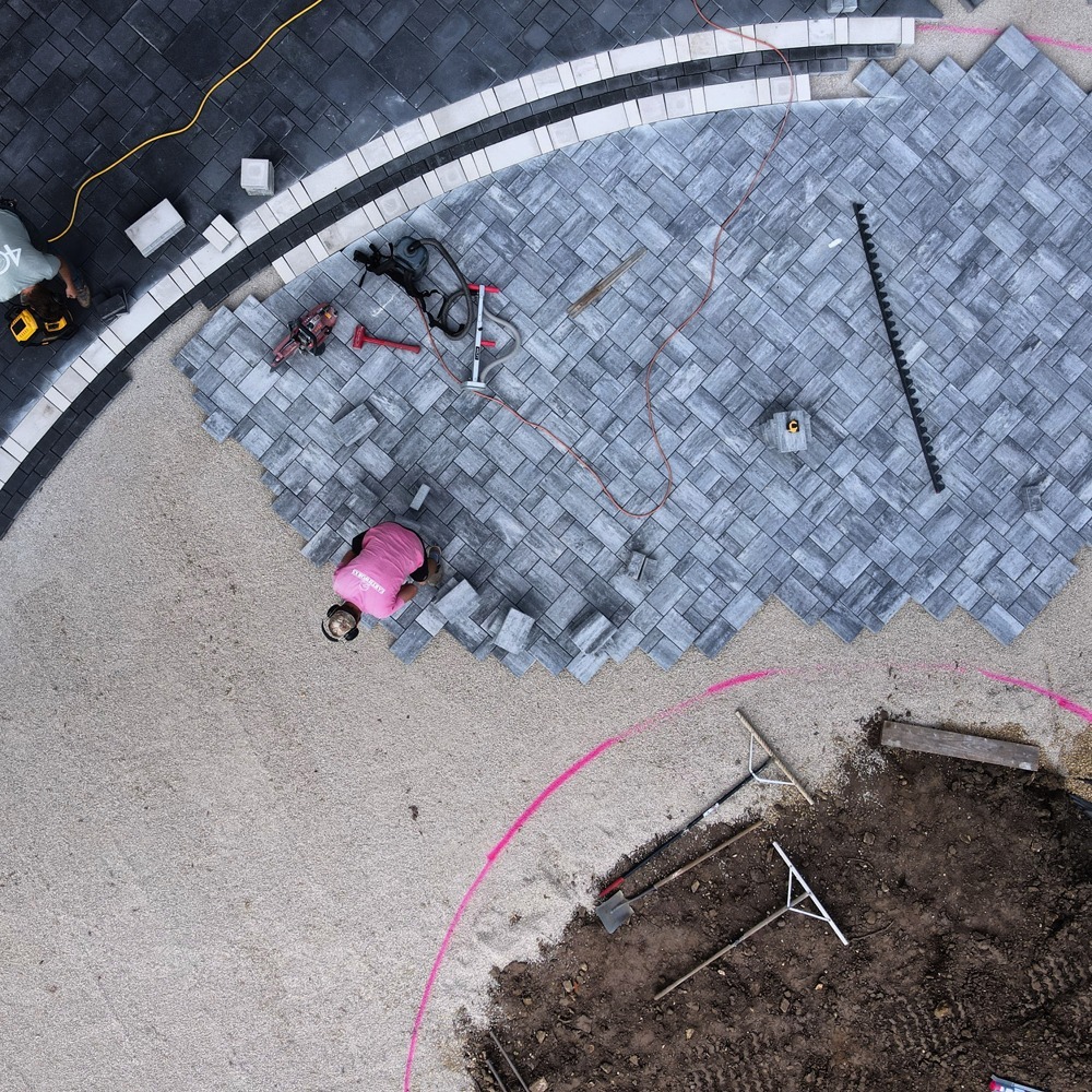 Gravel base preparation for patio with edge restraints and leveling