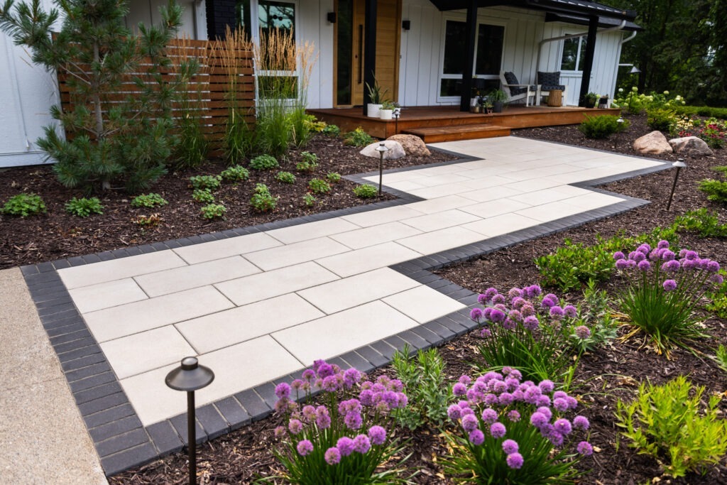 Spring Garden Preparation is key for a well-manicured garden with fresh mulch, vibrant flowers, and neatly trimmed shrubs in early spring.