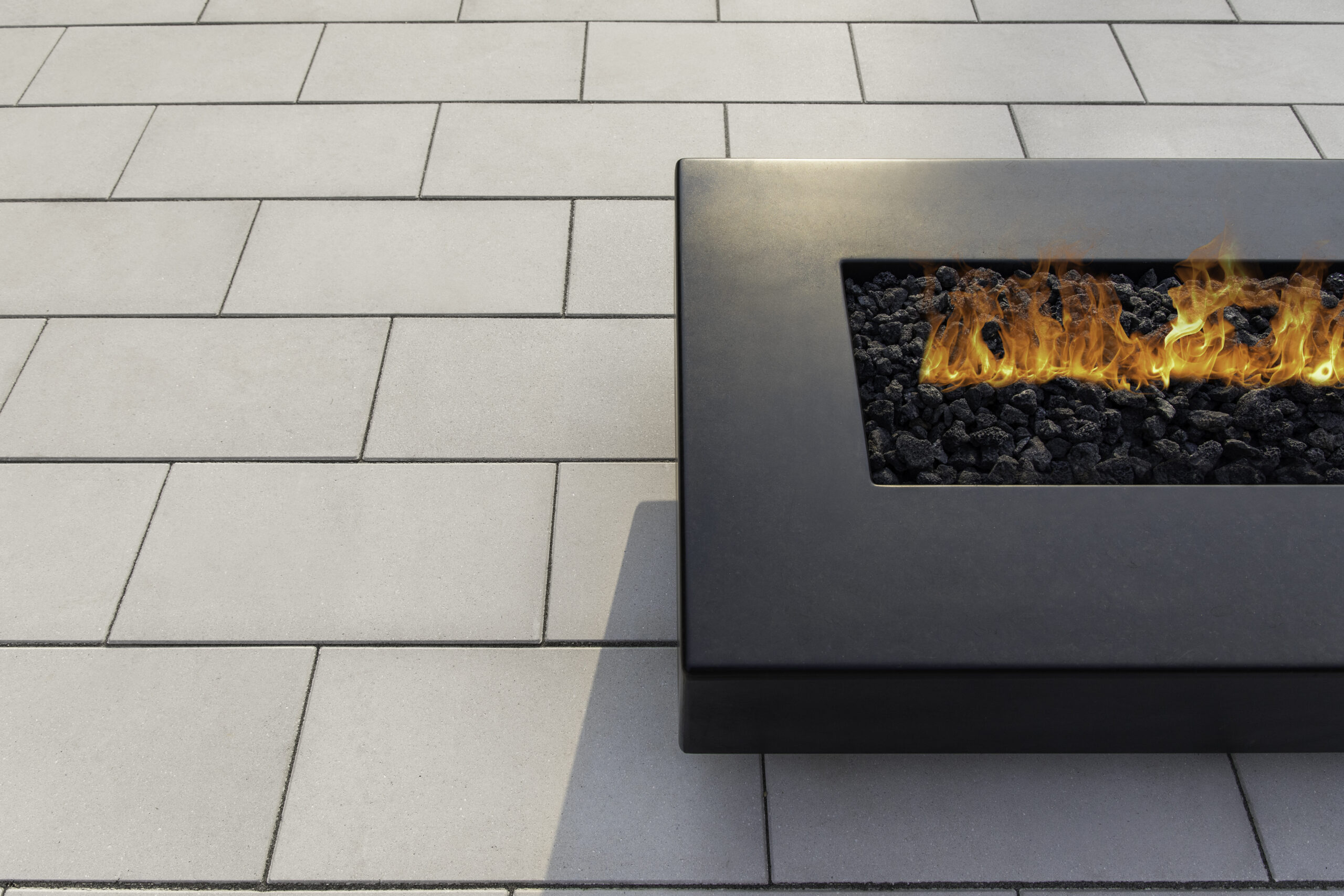 Overhead view of a custom paver patio foundation with seating area and fire feature
